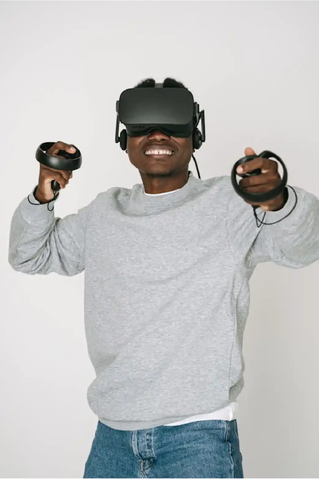 Smiling athlete wearing a VR headset and controllers